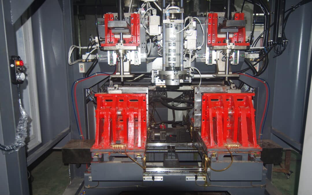 Dual clamping carriages under die head with parison cutting modules in extrusion blow molding machine