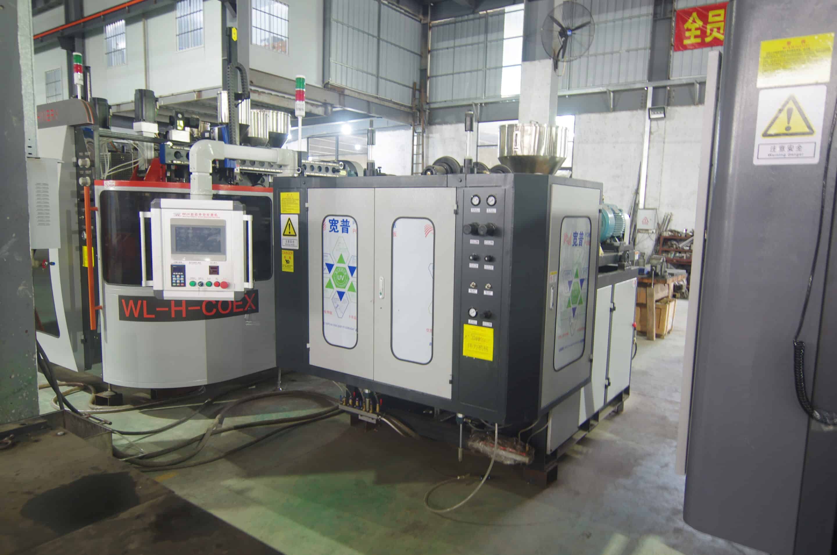 Transparent blow molding machine for food and beverage packaging.