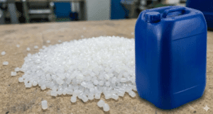 HMW HDPE resin pellets beside blue plastic jerry can on workbench