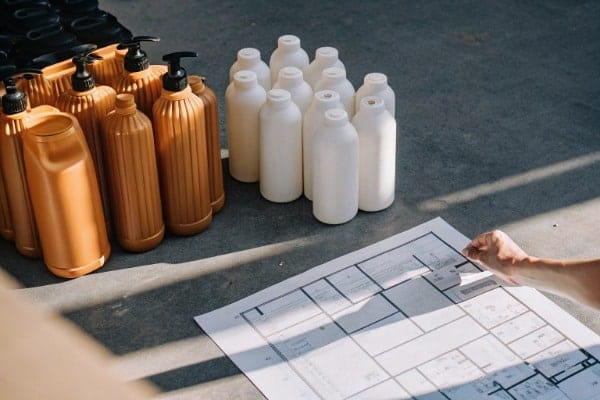 When purchasing an all-electric extrusion blow molding machine, how should I determine the appropriate tonnage based on product requirements?