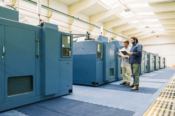 Modern spacious factory floor with machines and workers (ID#5)