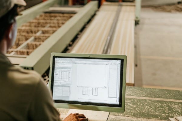 Engineer working on computer in factory setting (ID#5)